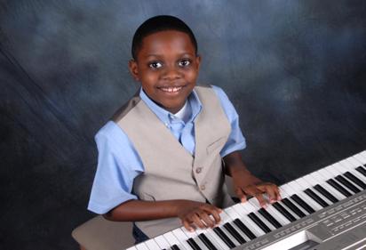 Boy plays the piano, piano lessons near me